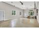 A spacious, multi-use garage interior with epoxy floor, windows, and potential for living or workspace at 5104 Carvel Ave, Indianapolis, IN 46205