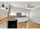 Bright kitchen with white cabinetry, a gas stove, and hardwood flooring at 5104 Carvel Ave, Indianapolis, IN 46205