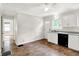 Bright kitchen features hardwood floors, white cabinets and door to the back at 5104 Carvel Ave, Indianapolis, IN 46205