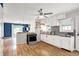 Bright kitchen with white cabinets, stainless steel appliances, and hardwood floors at 5104 Carvel Ave, Indianapolis, IN 46205