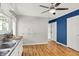 Open kitchen with white cabinets, neutral walls, and hardwood floors at 5104 Carvel Ave, Indianapolis, IN 46205