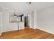 Open-concept space with hardwood floors and a view into the kitchen area at 5104 Carvel Ave, Indianapolis, IN 46205