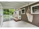 Charming porch featuring a comfortable hammock chair and a classic lattice design at 5104 Carvel Ave, Indianapolis, IN 46205