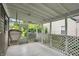 Relaxing screened-in porch with a cozy hammock chair and plenty of space at 5104 Carvel Ave, Indianapolis, IN 46205