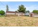 Spacious backyard with freshly seeded lawn, shed, and exterior stone details at 521 Sunset Dr, Edinburgh, IN 46124