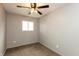Neutral bedroom featuring a ceiling fan with light, carpeted floors and gray walls at 521 Sunset Dr, Edinburgh, IN 46124