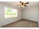Bright bedroom with neutral carpeting, natural light, and a ceiling fan for added comfort at 521 Sunset Dr, Edinburgh, IN 46124