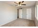 Neutral bedroom featuring a ceiling fan with light, carpeted floors and gray walls at 521 Sunset Dr, Edinburgh, IN 46124