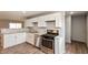 A beautifully designed kitchen equipped with stainless steel appliances, white cabinetry, and modern finishes at 521 Sunset Dr, Edinburgh, IN 46124