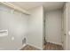 Clean laundry area with wood flooring, storage solutions, and convenient utility connections for appliances at 521 Sunset Dr, Edinburgh, IN 46124