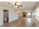 Spacious living room featuring a stone fireplace, ceiling fans, and abundant natural light at 521 Sunset Dr, Edinburgh, IN 46124
