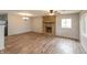 Open living room with hardwood floors and a stone fireplace for a cozy ambiance at 521 Sunset Dr, Edinburgh, IN 46124