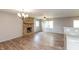 Bright living area features hardwood floors, stone fireplace, and modern lighting fixtures at 521 Sunset Dr, Edinburgh, IN 46124