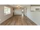 Inviting open-concept living room with hardwood floors and large windows for natural light at 521 Sunset Dr, Edinburgh, IN 46124