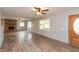 Bright living room with hardwood floors, stone fireplace, and a welcoming atmosphere at 521 Sunset Dr, Edinburgh, IN 46124