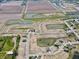 Aerial view of a new community development with ponds, cul-de-sac streets, and homes under construction at 5216 Cartland Dr, Indianapolis, IN 46239