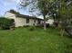 Expansive backyard with mature trees, providing a tranquil outdoor space for recreation and relaxation at 5416 Straw Hat Dr, Indianapolis, IN 46237
