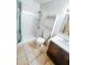 Well-lit bathroom features a shower with a modern showerhead and vanity with under-sink storage at 5416 Straw Hat Dr, Indianapolis, IN 46237