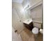 This bathroom is ready for your personal touches with tile flooring, vanity and storage at 5416 Straw Hat Dr, Indianapolis, IN 46237