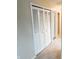 Closet with bi-fold doors showing access to the hallway and neutral carpet at 5416 Straw Hat Dr, Indianapolis, IN 46237