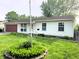 Charming single-story home featuring vinyl siding, a red garage door, and well-maintained front yard at 5416 Straw Hat Dr, Indianapolis, IN 46237