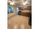 Functional kitchen featuring dark cabinets, black appliances, and light tile flooring for easy maintenance at 5416 Straw Hat Dr, Indianapolis, IN 46237