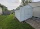 A white storage shed in the backyard, offering practical and secure space for tools or hobbies at 5416 Straw Hat Dr, Indianapolis, IN 46237