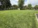 View of large backyard featuring green grass and a fence at 5585 Gallagher Dr, Greenwood, IN 46142