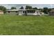 Expansive backyard with lush lawn and partial view of the house at 5585 Gallagher Dr, Greenwood, IN 46142
