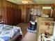 Bedroom with wood paneled walls, ceiling fan and packed cardboard moving boxes at 5585 Gallagher Dr, Greenwood, IN 46142