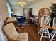 View of dining area featuring hardwood floors and multiple chairs at 5585 Gallagher Dr, Greenwood, IN 46142