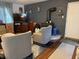 Living room featuring brick wall fireplace and hardwood flooring at 5585 Gallagher Dr, Greenwood, IN 46142