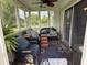 Relaxing screened porch with outdoor seating and ceiling fan at 5585 Gallagher Dr, Greenwood, IN 46142