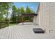Exterior view of the backyard patio and pergola featuring a well-maintained lawn at 5786 E Fall Creek Pkwy N Dr, Indianapolis, IN 46226