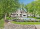 Beautiful backyard featuring a swimming pool, mature landscaping and steps to the lake at 5786 E Fall Creek Pkwy N Dr, Indianapolis, IN 46226