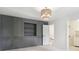 Bedroom with custom gray feature wall and built-in shelving, and neutral colored walls at 5786 E Fall Creek Pkwy N Dr, Indianapolis, IN 46226