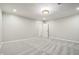 Large bedroom with plush carpeting and recessed lighting offers a relaxing retreat at 5786 E Fall Creek Pkwy N Dr, Indianapolis, IN 46226