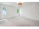 Large bedroom featuring carpet, neutral walls, and natural light coming through the windows at 5786 E Fall Creek Pkwy N Dr, Indianapolis, IN 46226