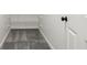 View of closet with gray carpet, wire shelving, and white door at 5786 E Fall Creek Pkwy N Dr, Indianapolis, IN 46226