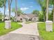 Beautiful front exterior view of a home with a circular driveway, well-manicured lawn, and inviting curb appeal at 5786 E Fall Creek Pkwy N Dr, Indianapolis, IN 46226