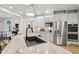 Kitchen featuring granite countertops, stainless steel appliances, island sink, and white cabinetry at 5786 E Fall Creek Pkwy N Dr, Indianapolis, IN 46226