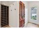 Mudroom with built-in shelving, hooks, and a window for natural light at 5786 E Fall Creek Pkwy N Dr, Indianapolis, IN 46226