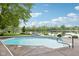 Backyard features a sparkling pool with direct access to the serene lake at 5786 E Fall Creek Pkwy N Dr, Indianapolis, IN 46226