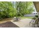 Cozy backyard patio with seating, surrounded by lush greenery for a private outdoor retreat at 5988 White Birch Dr, Fishers, IN 46038