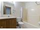 Functional bathroom with wood vanity, framed mirror, and tub with shower at 5988 White Birch Dr, Fishers, IN 46038