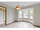 Bright dining area boasts a charming light fixture and large bay window at 5988 White Birch Dr, Fishers, IN 46038