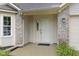 Charming home featuring a light brick facade and white front door at 5988 White Birch Dr, Fishers, IN 46038