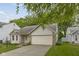 Charming home featuring brick accents, a two-car garage, and a well-manicured lawn at 5988 White Birch Dr, Fishers, IN 46038