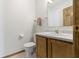 Practical half bath with wood vanity and ceramic tile floor at 5988 White Birch Dr, Fishers, IN 46038