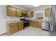 Modern kitchen with stainless steel appliances, stylish cabinetry, and granite countertops, perfect for culinary enthusiasts at 5988 White Birch Dr, Fishers, IN 46038